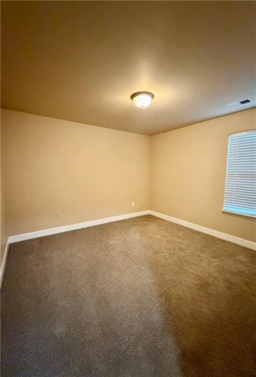 1985 Boatswain Drive Hampton, GA 30228 - Photo 7 of 14 an empty room with a natural light