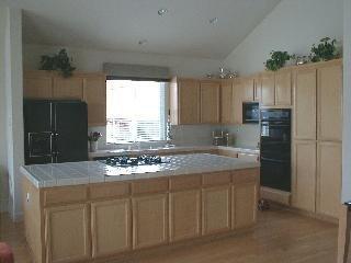 35 Montevideo Way San Rafael, CA 94903 - Photo 5 of 6 a kitchen with kitchen island granite countertop a sink stove and refrigerator