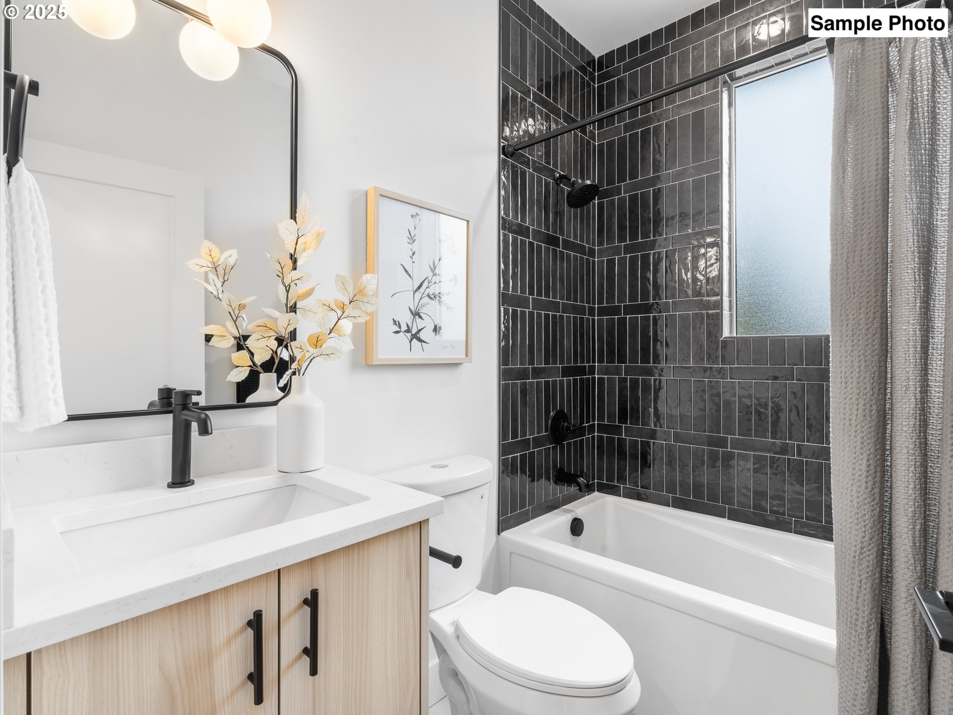 3554 North Haight Avenue, Unit 3 Portland, OR 97227 - Photo 18 of 20 a bathroom with a bathtub sink vanity mirror and toilet