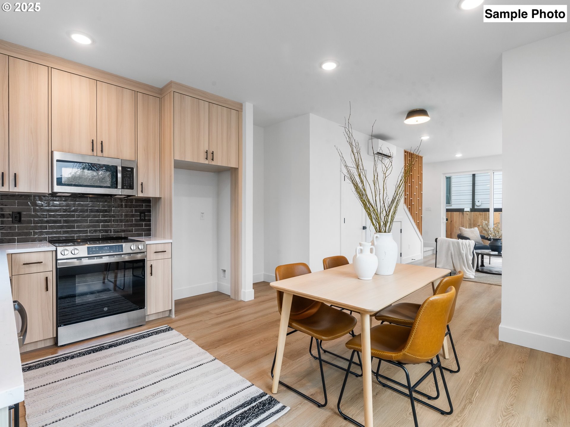 3554 North Haight Avenue, Unit 3 Portland, OR 97227 - Photo 7 of 20 a view of a dining room with furniture and wooden floor