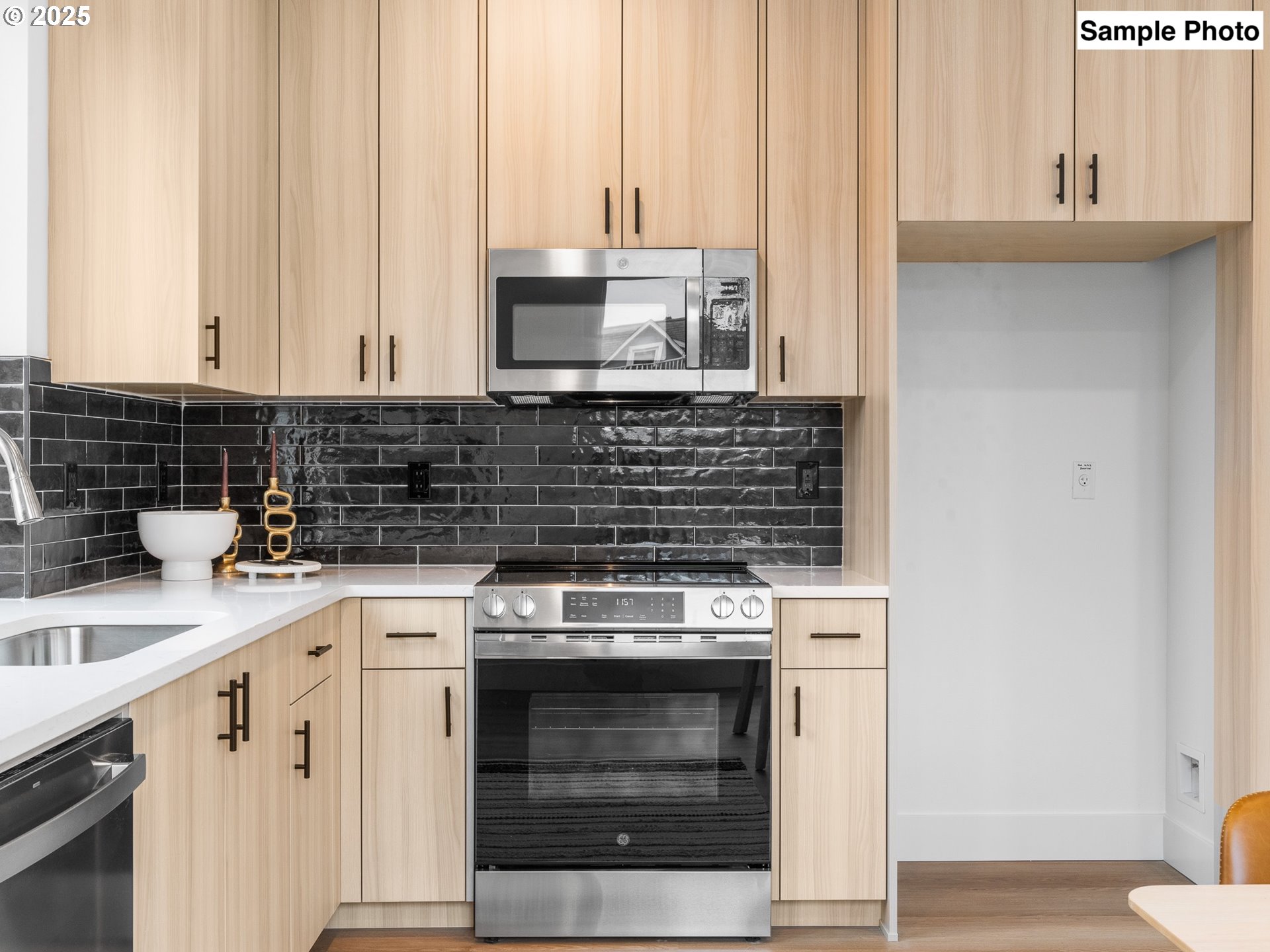 3554 North Haight Avenue, Unit 3 Portland, OR 97227 - Photo 9 of 20 a kitchen with a stove and white cabinets