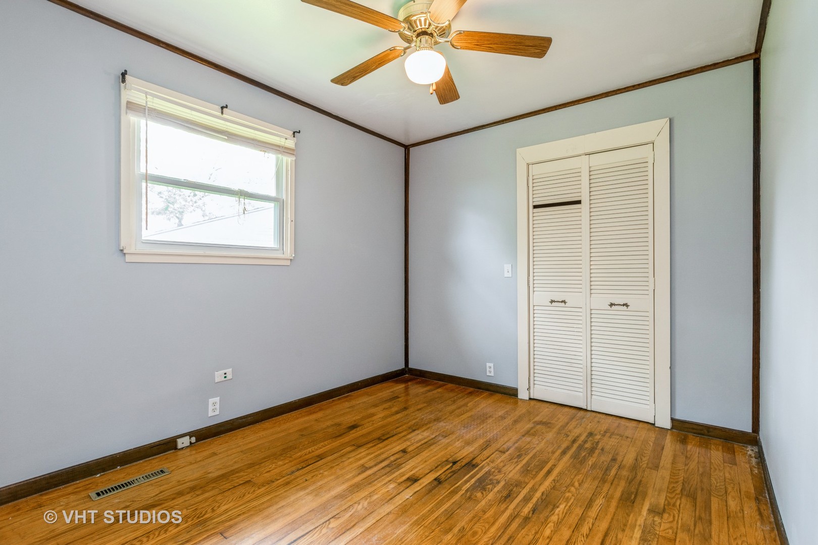 34 A Robin Road Carpentersville, IL 60110 - Photo 8 of 10 a view of an empty room with wooden floor and a window