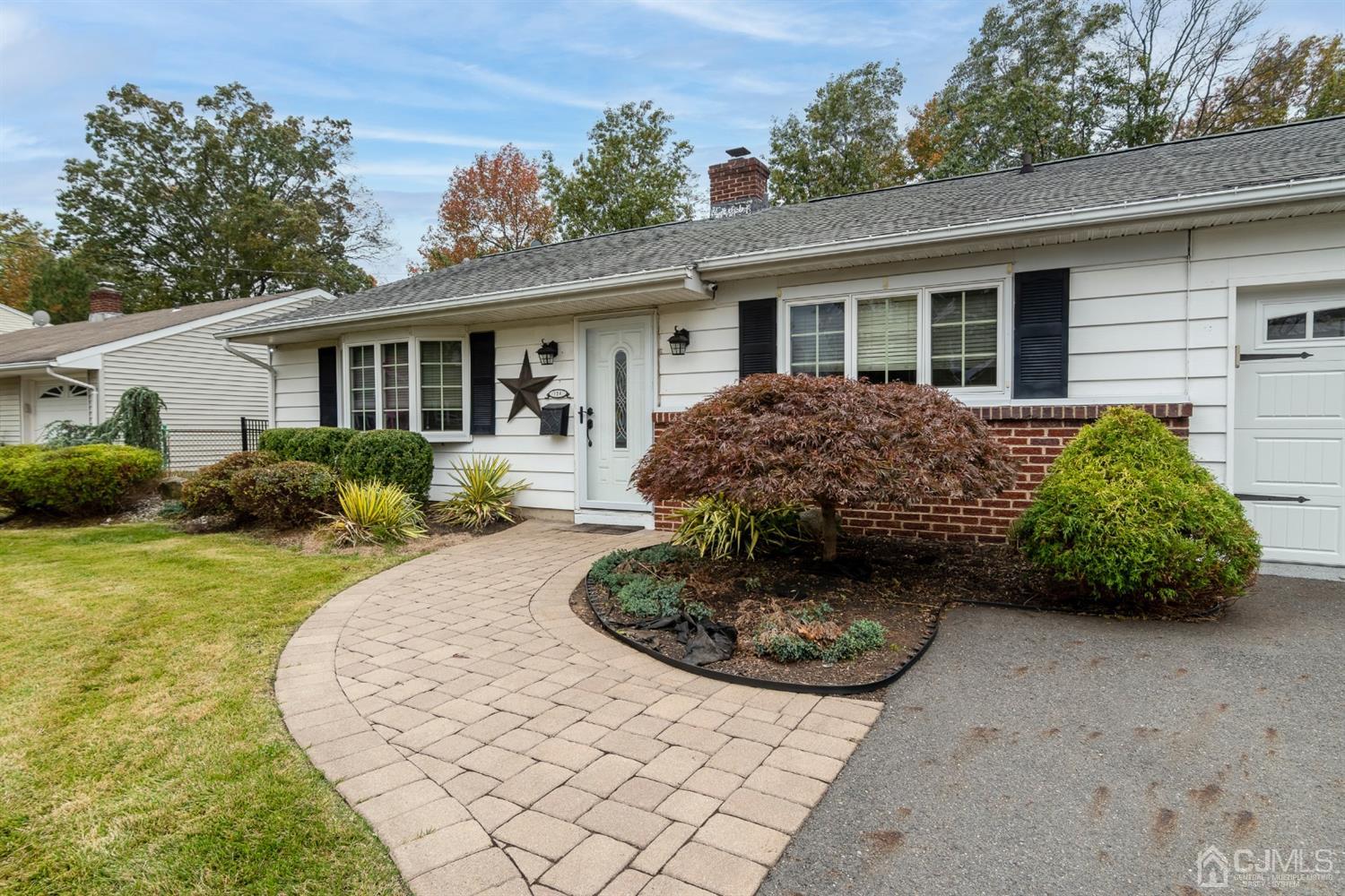 154 Winthrop Road Edison, NJ 08817 - Photo 1 of 18 a front view of a house with garden