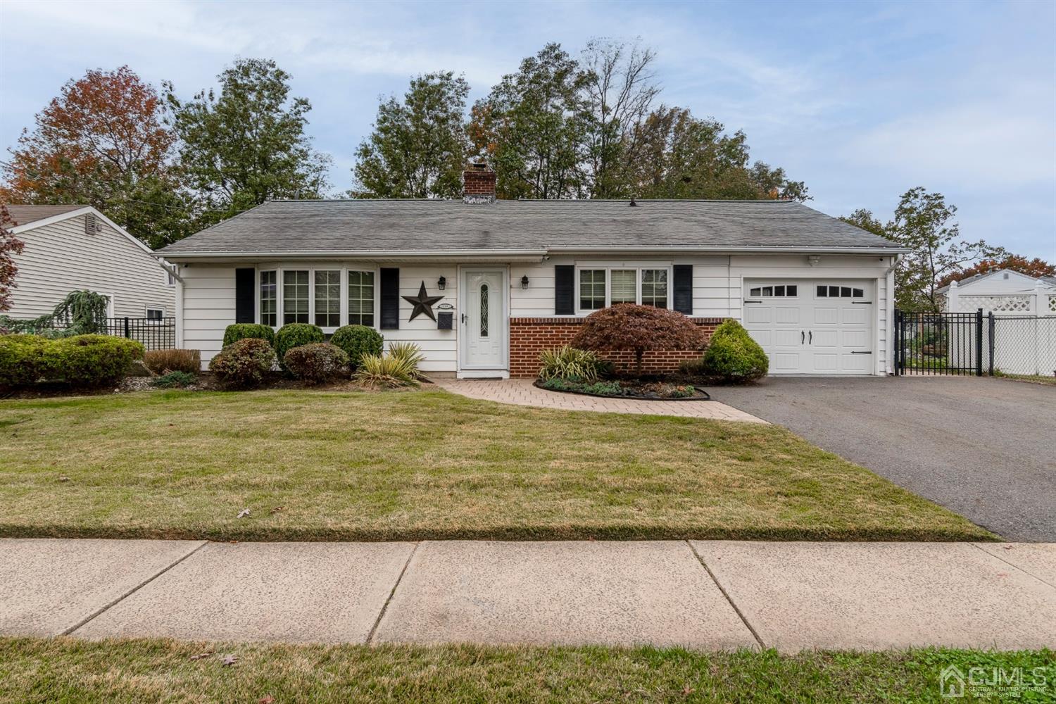 154 Winthrop Road Edison, NJ 08817 - Photo 2 of 18 a front view of a house with garden