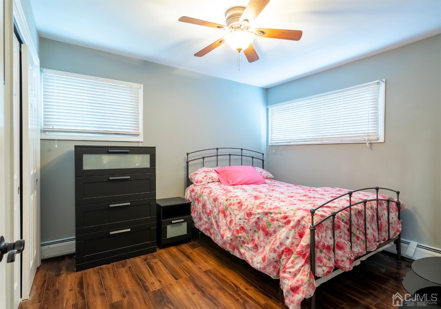 154 Winthrop Road Edison, NJ 08817 - Photo 11 of 18 a bedroom with a bed and a dresser
