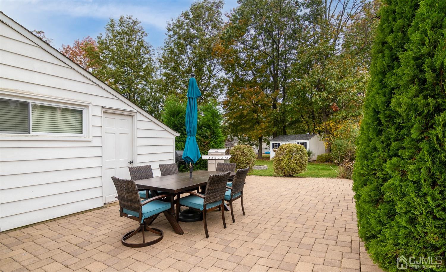 154 Winthrop Road Edison, NJ 08817 - Photo 14 of 18 a view of a dining table and chairs in the patio