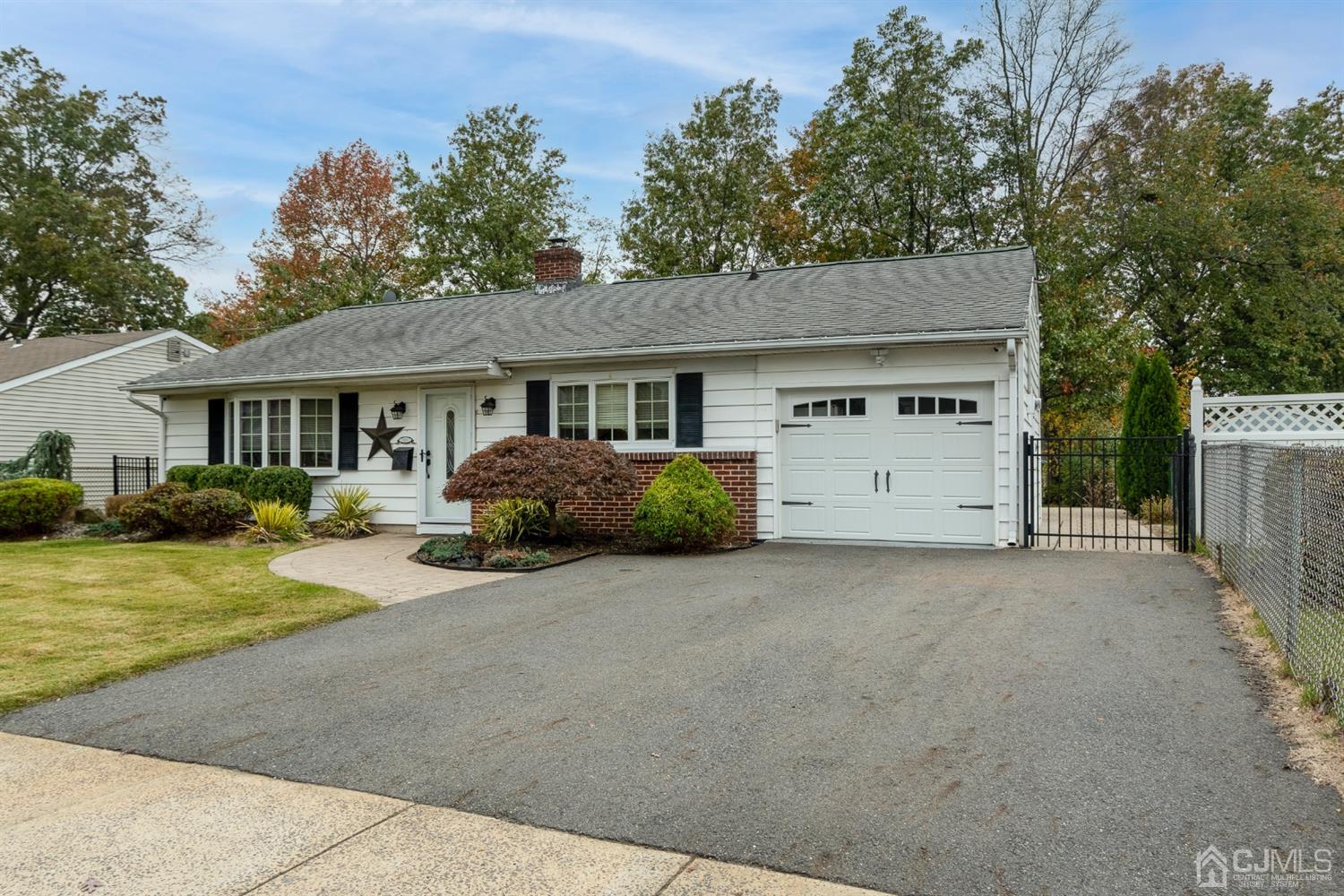 154 Winthrop Road Edison, NJ 08817 - Photo 18 of 18 a view of a house with a yard and large tree