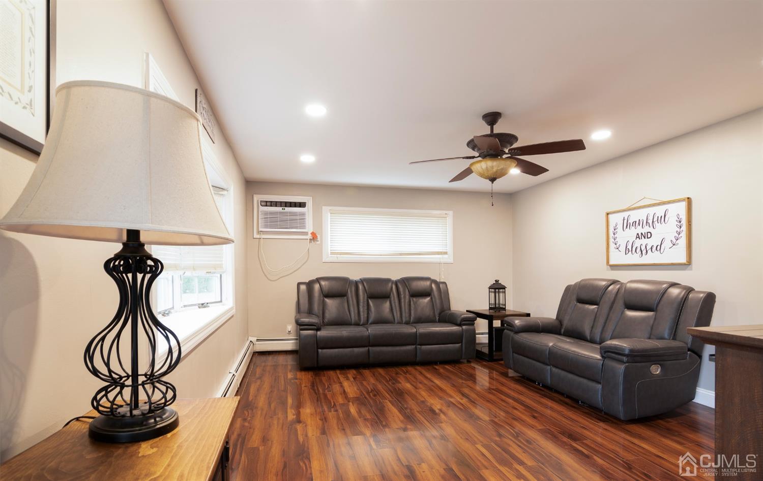 154 Winthrop Road Edison, NJ 08817 - Photo 4 of 18 a living room with furniture and a wooden floor