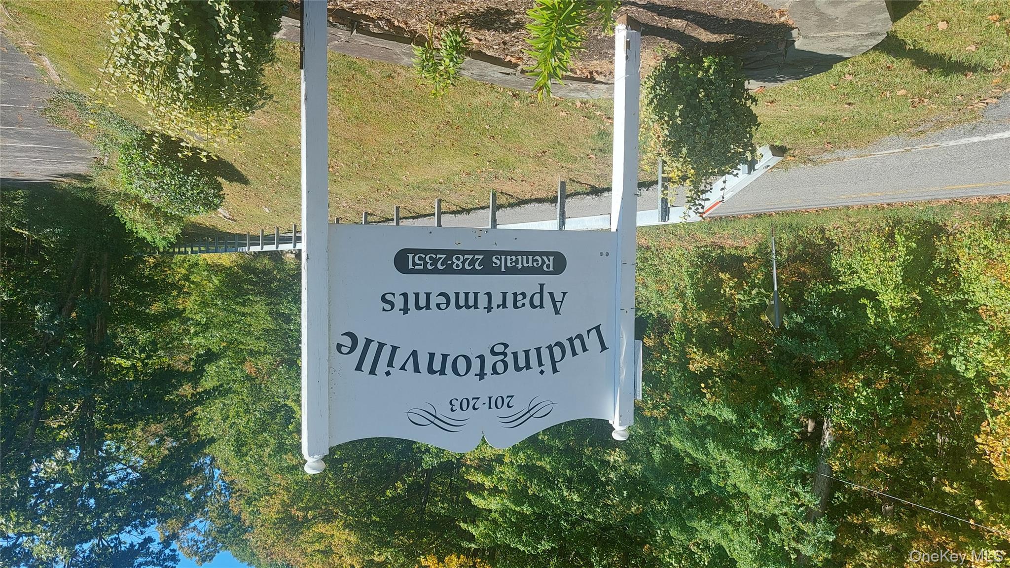 Community sign with a lawn