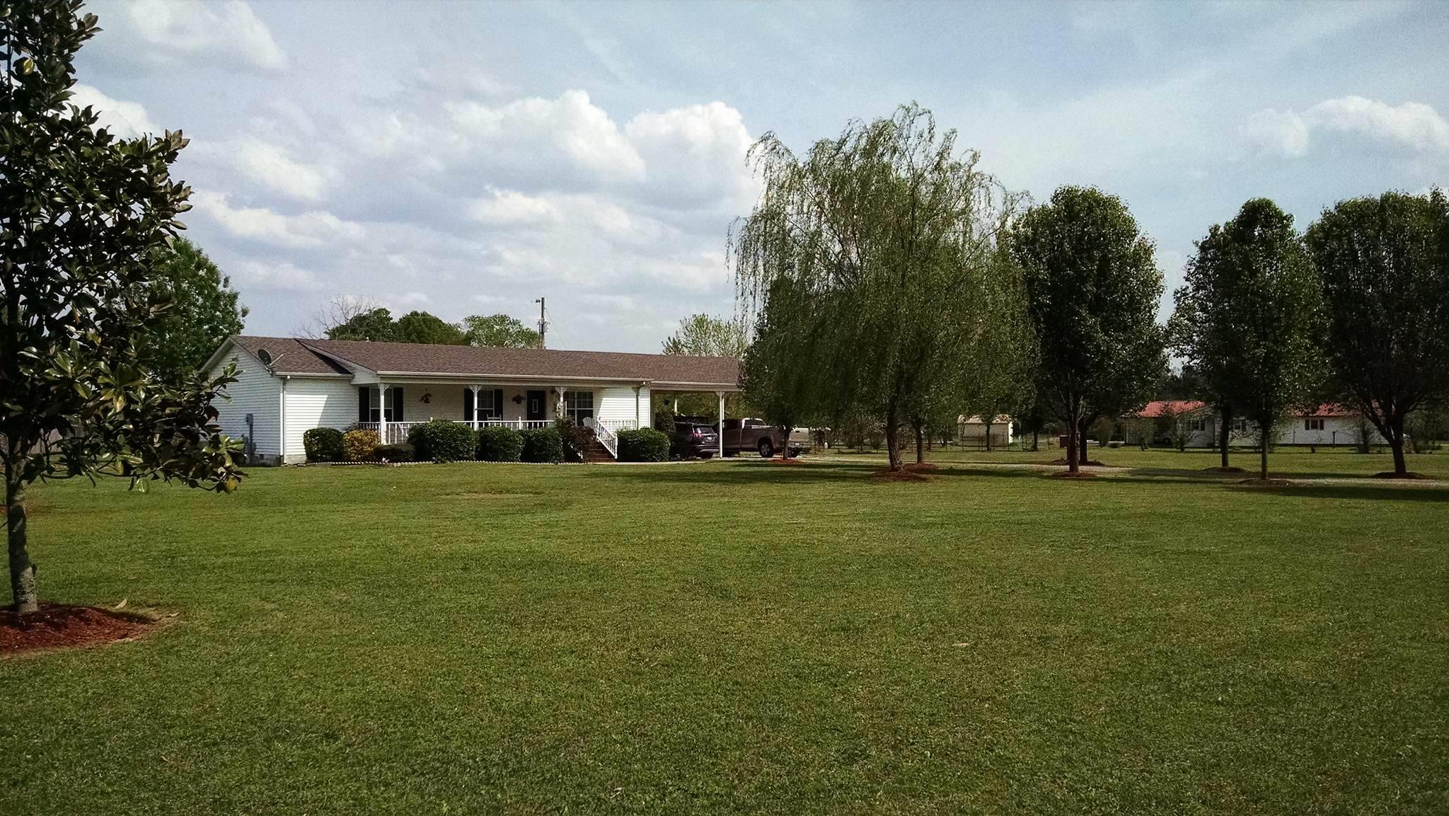 106 Walter Bartlett Road Manchester, TN 37355 - Photo 1 of 26 a front view of a house with a garden
