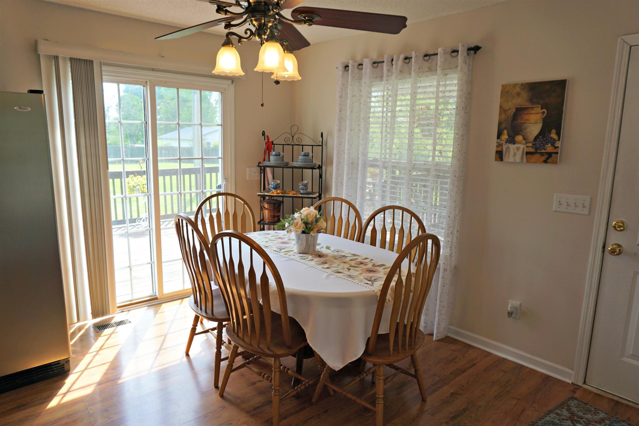 106 Walter Bartlett Road Manchester, TN 37355 - Photo 12 of 26 a view of a dining room with furniture window and wooden floor