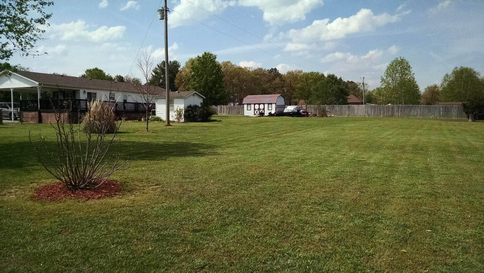 106 Walter Bartlett Road Manchester, TN 37355 - Photo 25 of 26 a front view of a house with a garden and trees