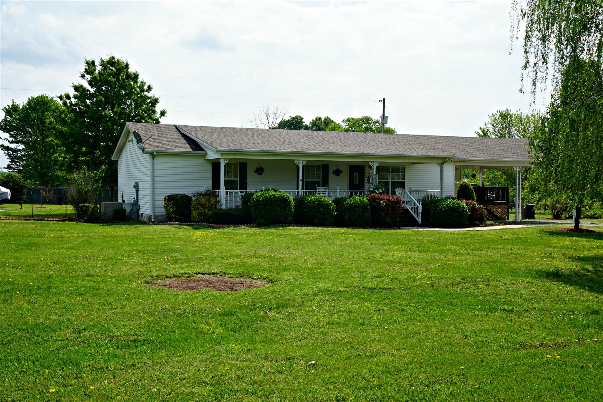 106 Walter Bartlett Road Manchester, TN 37355 - Photo 3 of 26 a view of a house with a yard and potted plants