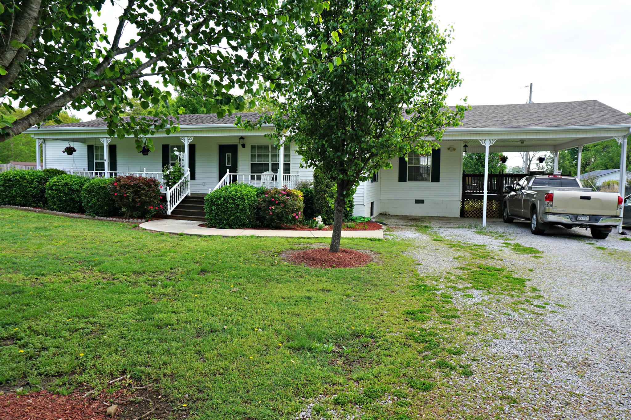 106 Walter Bartlett Road Manchester, TN 37355 - Photo 5 of 26 a front view of a house with a yard and garage