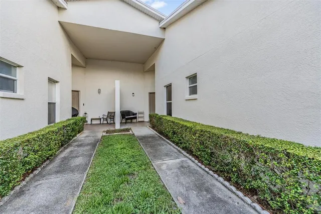 a view of a pathway both side of a house