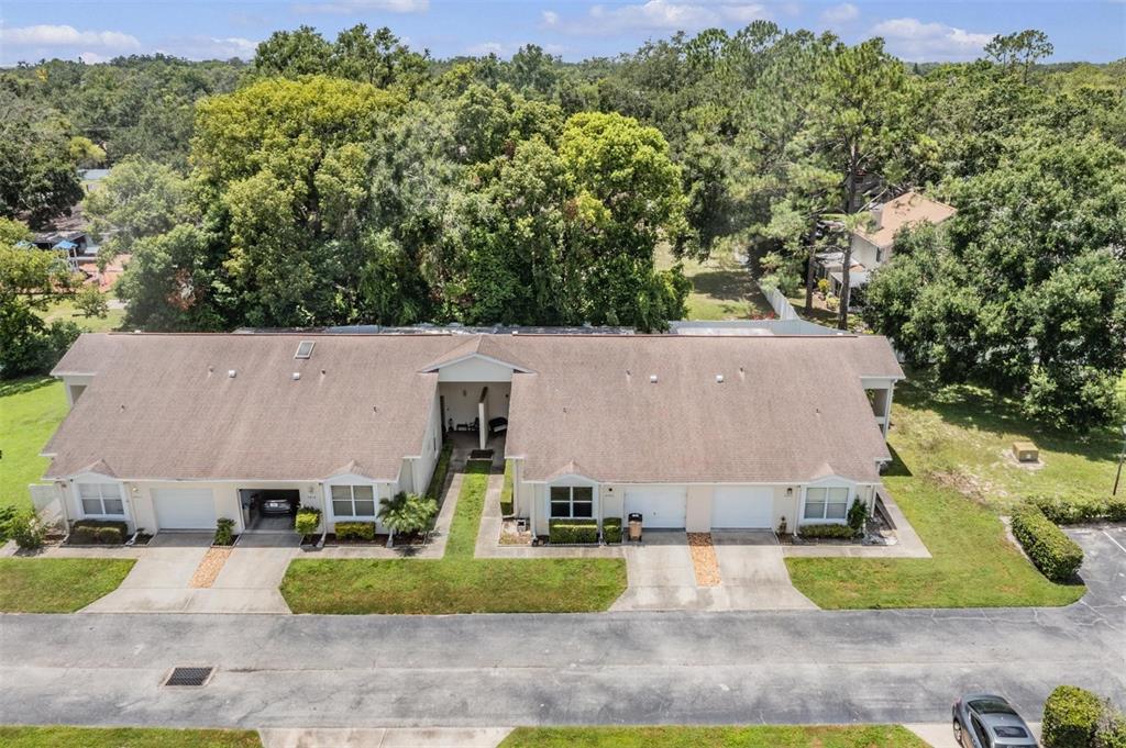 8406 Terrace Meadows Court Temple Terrace, FL 33637 - Photo 37 of 39 an aerial view of a house with a yard and a large barn