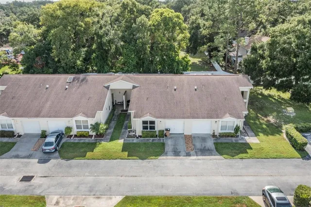 an aerial view of a house with outdoor space