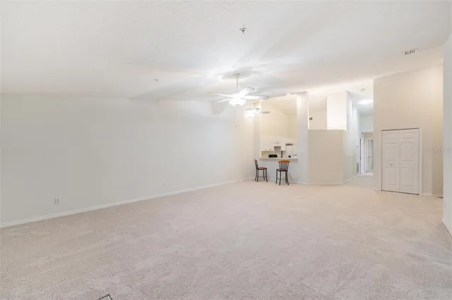 a view of a livingroom with furniture and a flat screen tv