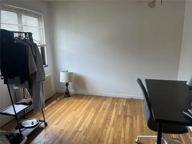 a view of a room with gym equipment and a window