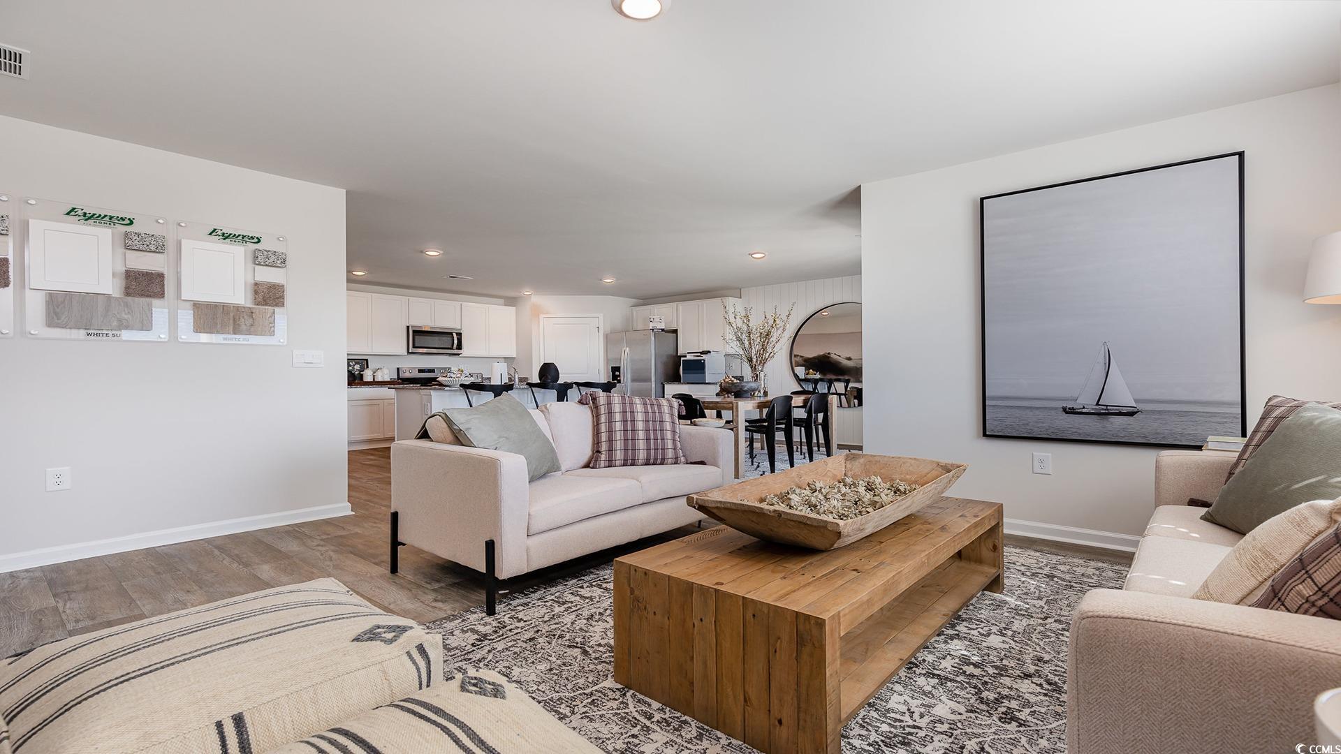 300 Long Beard Way Loris, SC 29569 - Photo 14 of 40 Living area with light wood-style floors and recessed lighting