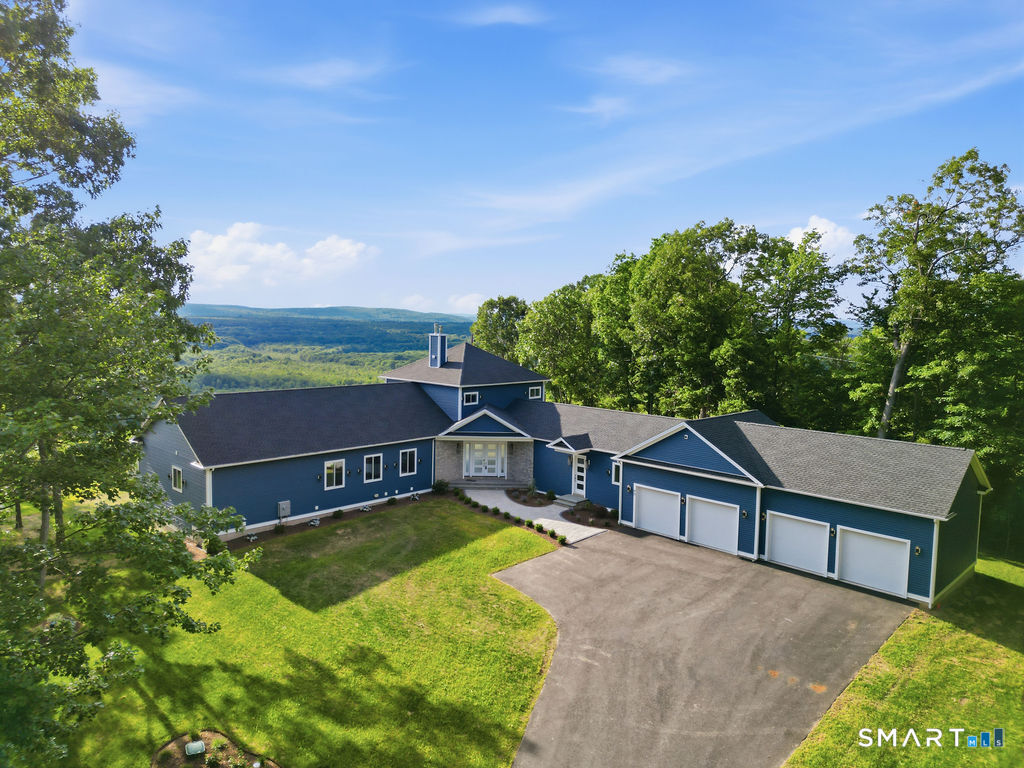 62 Pinnacle Road Farmington, CT 06032 - Photo 1 of 40 a view of a house with a big yard and large trees