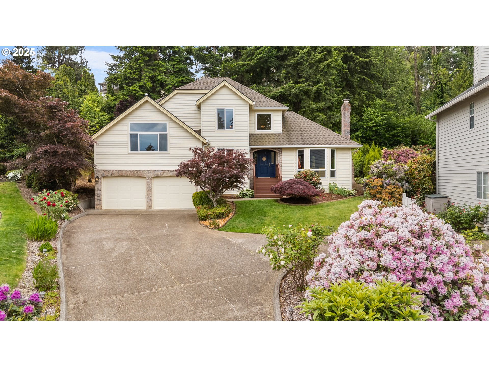6502 Apollo Road West Linn, OR 97068 - Photo 1 of 48 a black and white house with a yard and garden