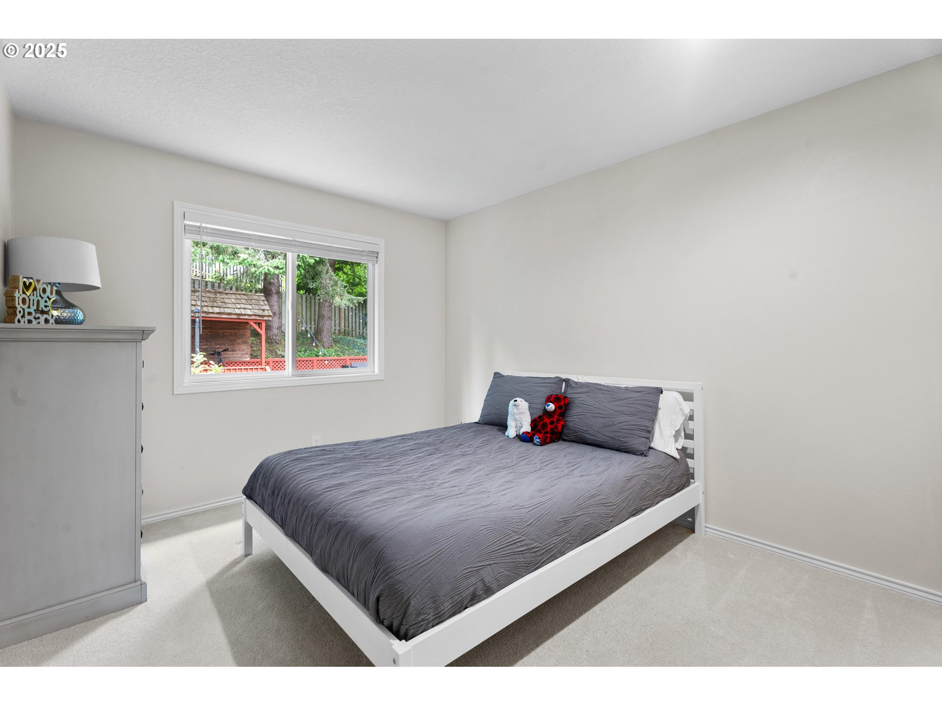 6502 Apollo Road West Linn, OR 97068 - Photo 15 of 48 a bedroom with a bed and a window