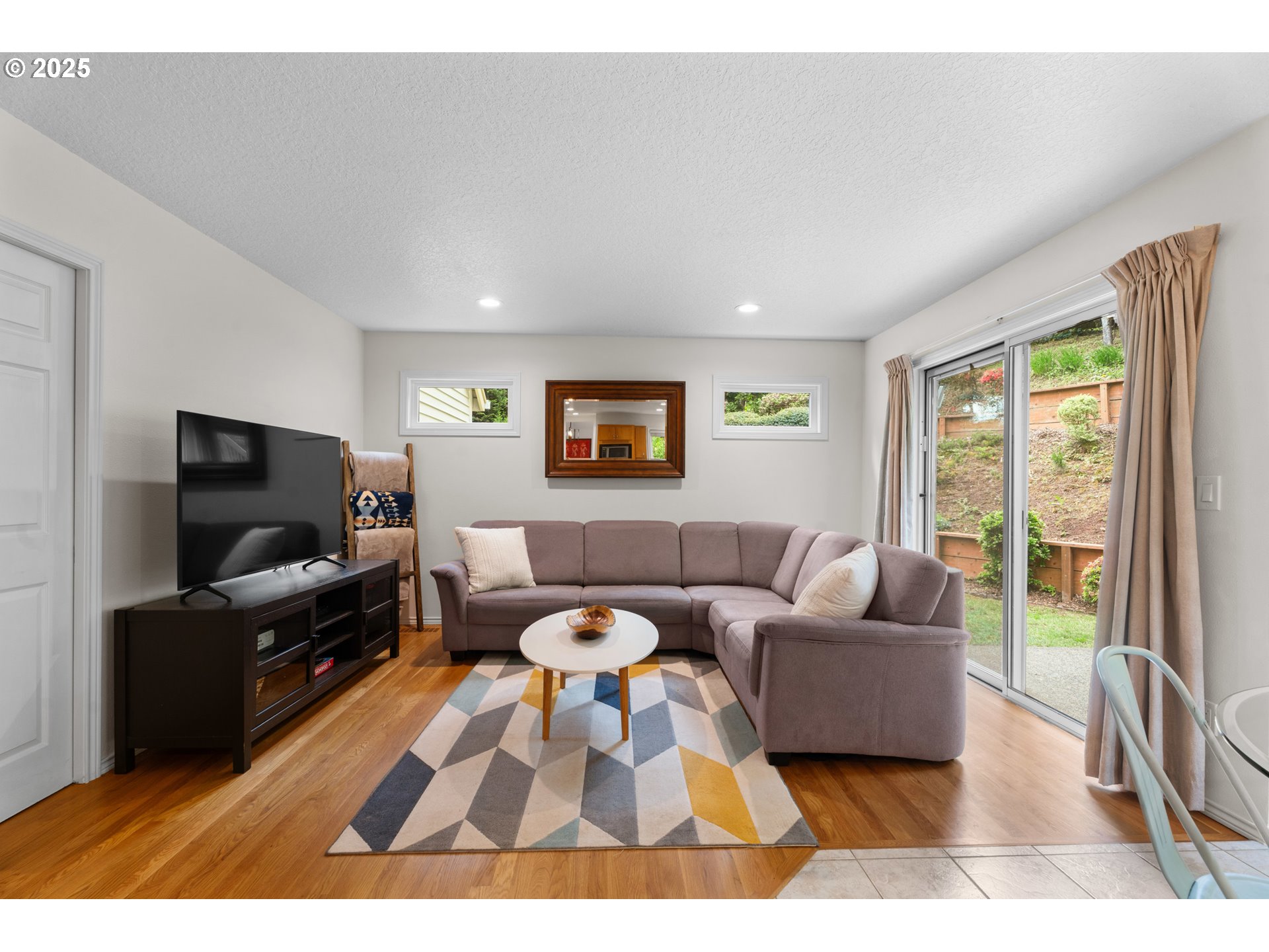 6502 Apollo Road West Linn, OR 97068 - Photo 26 of 48 a living room with furniture and a flat screen tv