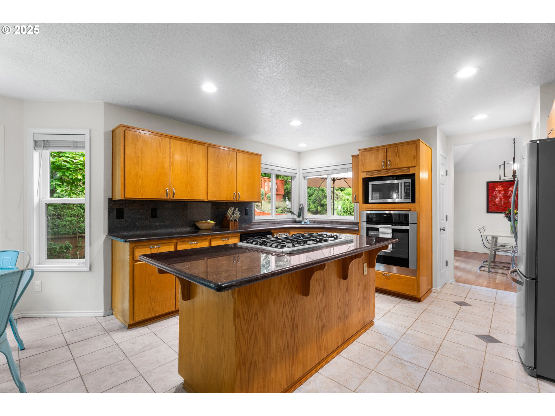 6502 Apollo Road West Linn, OR 97068 - Photo 27 of 48 a kitchen with stainless steel appliances granite countertop a stove a sink and a refrigerator