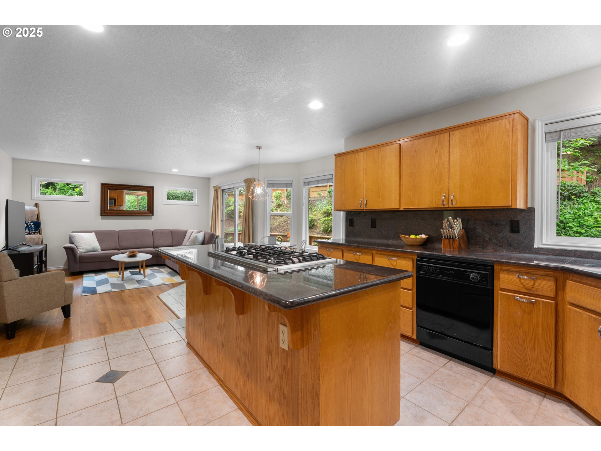 6502 Apollo Road West Linn, OR 97068 - Photo 31 of 48 a kitchen with stainless steel appliances granite countertop a stove a sink dishwasher and a refrigerator