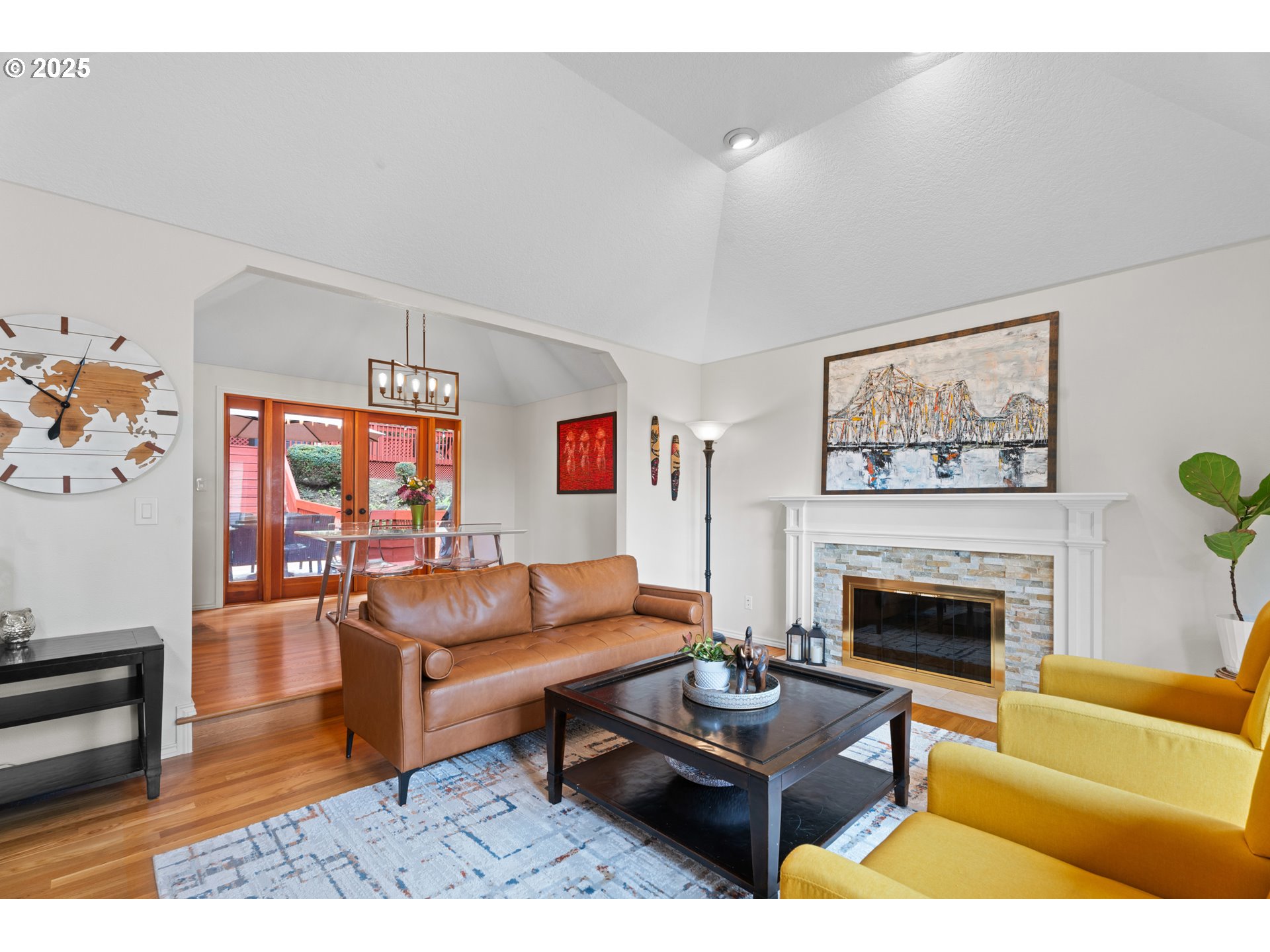 6502 Apollo Road West Linn, OR 97068 - Photo 36 of 48 a living room with furniture a fireplace and a wall painting