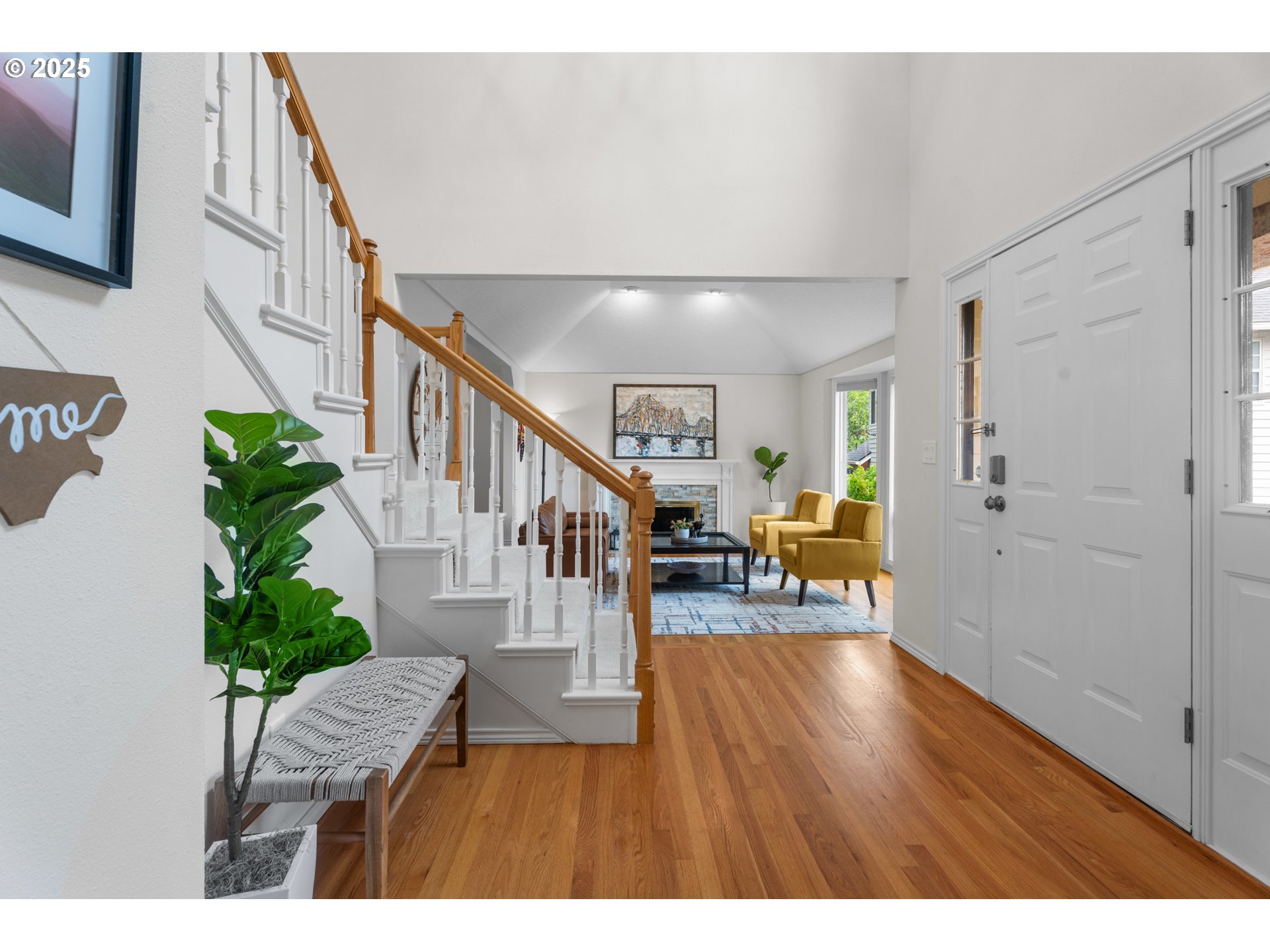 6502 Apollo Road West Linn, OR 97068 - Photo 4 of 48 a view of an entryway with wooden floor and a livingroom