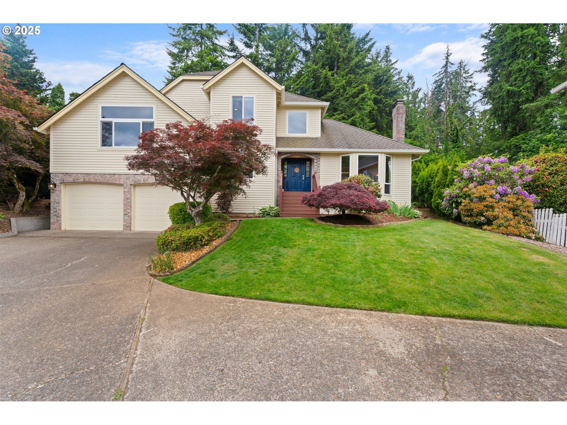 6502 Apollo Road West Linn, OR 97068 - Photo 48 of 48 a front view of a house with a garden and yard