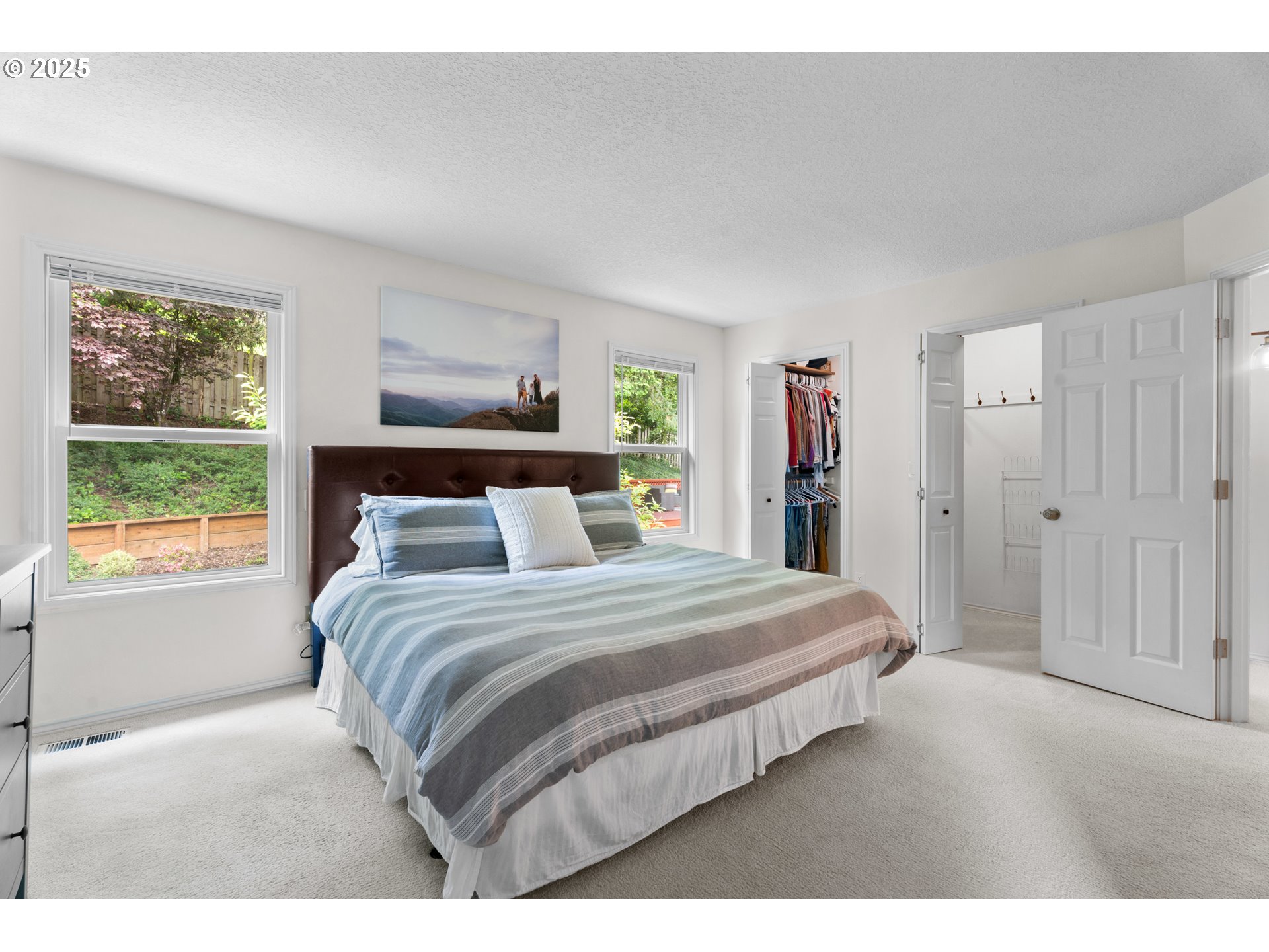 6502 Apollo Road West Linn, OR 97068 - Photo 7 of 48 a bedroom with a large bed and a window