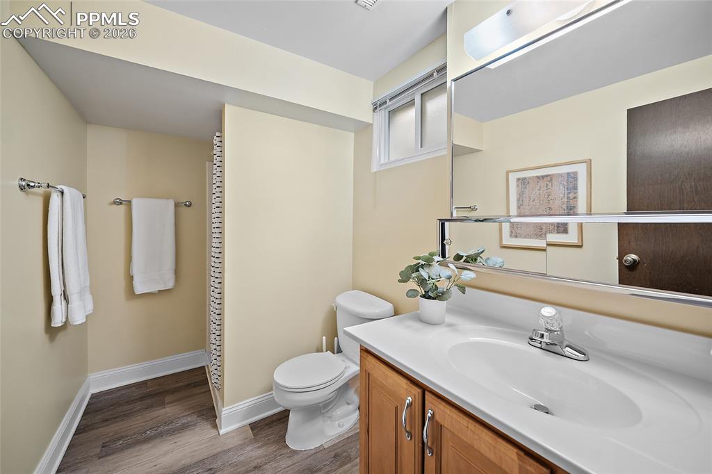 2304 Lazy R Lane Colorado Springs, CO 80915 - Photo 33 of 49 a bathroom with a granite countertop sink toilet and shower