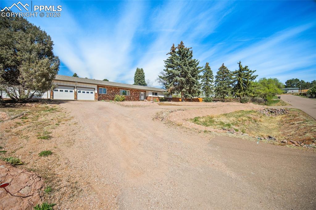 2304 Lazy R Lane Colorado Springs, CO 80915 - Photo 38 of 49 a view of road with large trees