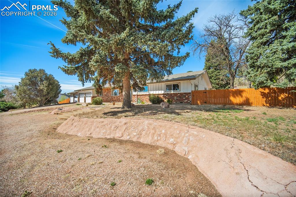 2304 Lazy R Lane Colorado Springs, CO 80915 - Photo 40 of 49 a street view with large trees