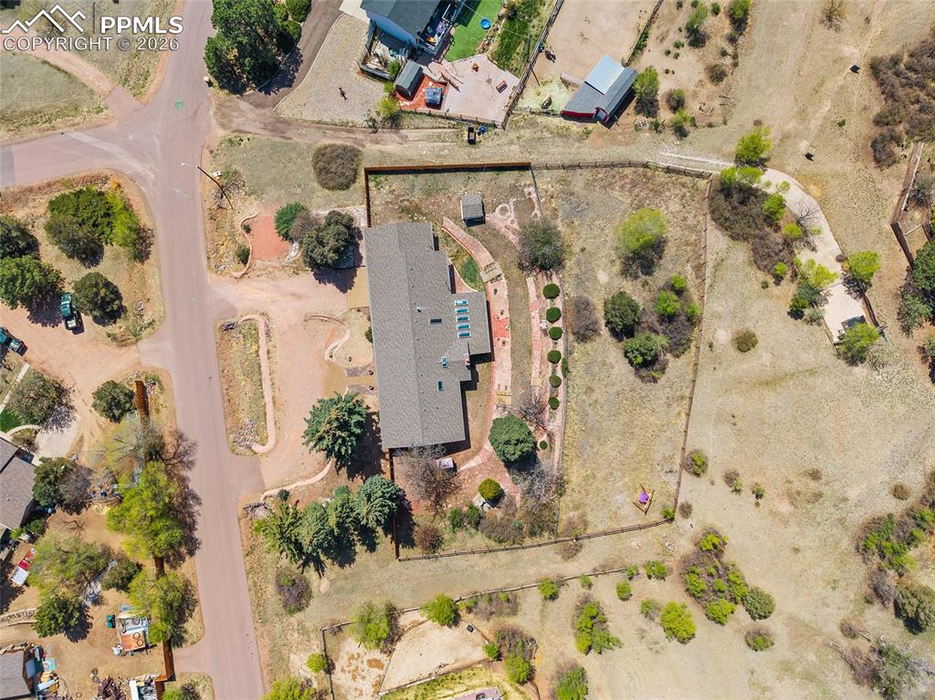 2304 Lazy R Lane Colorado Springs, CO 80915 - Photo 41 of 49 an aerial view of a house with a yard and wooden fence