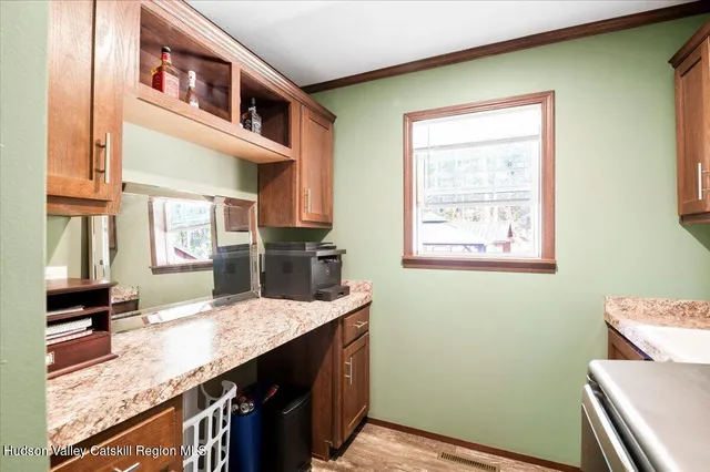 a kitchen that has a sink and a table in it