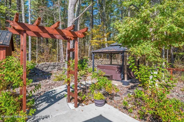 a backyard of a house with outdoor seating
