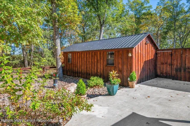 front view of a house with a tree