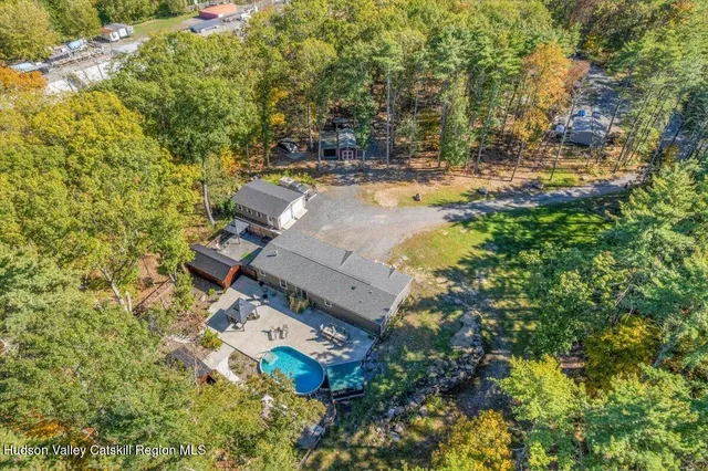 an aerial view of a house with swimming pool