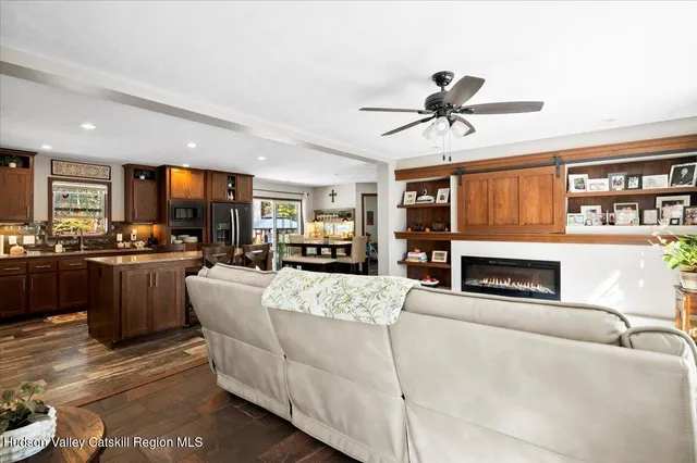 a view of a house with swimming pool and sitting area