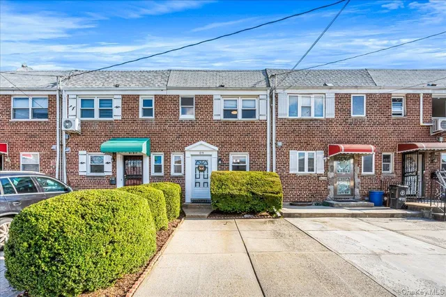 a front view of a building with garden