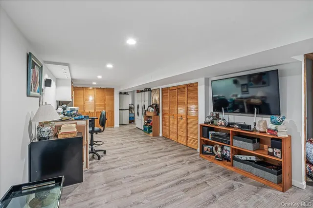 a view of a livingroom with furniture and a flat screen tv