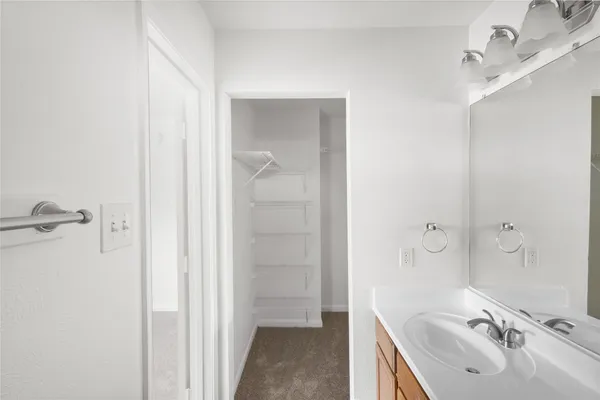a bathroom with a sink and mirror