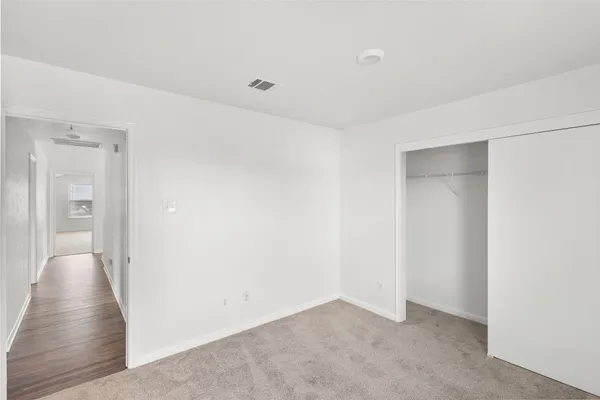 a view of a livingroom with wooden floor