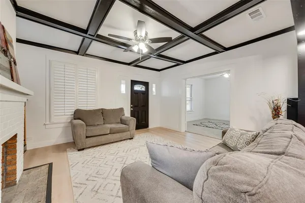 a bedroom with furniture and a fireplace