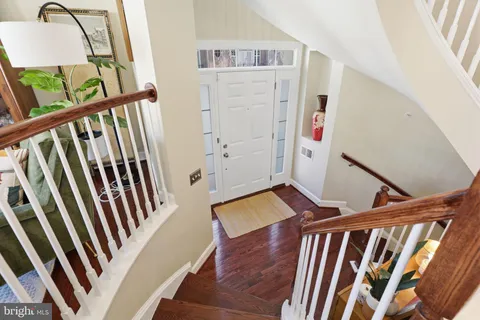 a view of a dining room with furniture and clothes