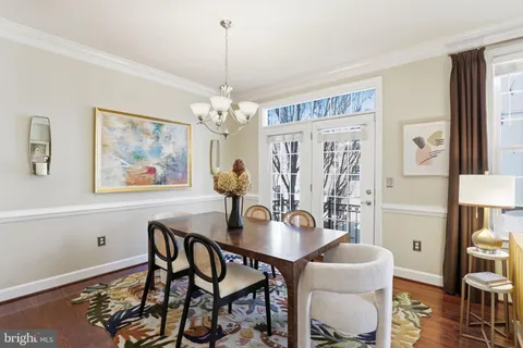 a large kitchen with stainless steel appliances granite countertop a large window and a refrigerator